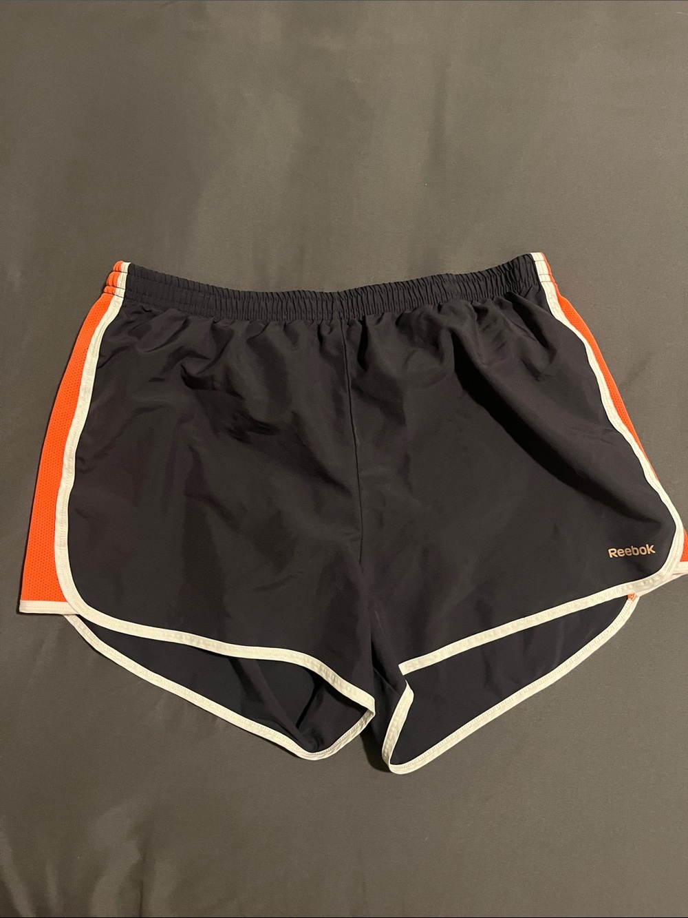 Reebok Women's Black Athletic Shorts with Orange and White Trim